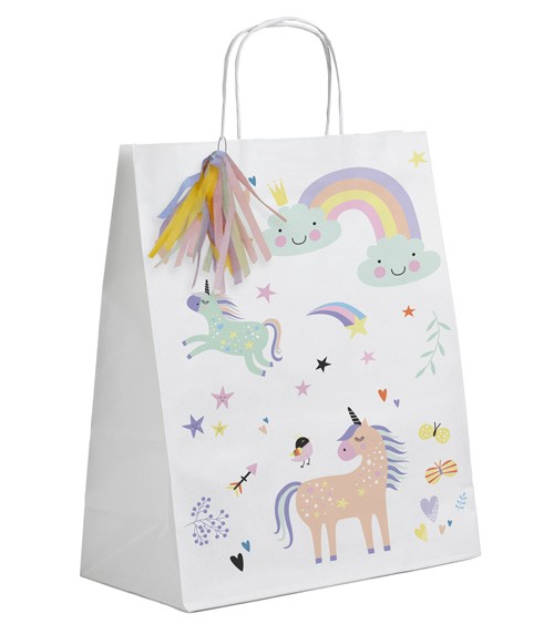 Cremefarbene Papiertüten mit Henkeln, niedlichen Einhorn-Motiven in zarten Pastellfarben und bunten Papierquasten, für süße Mitgebsel. Größe: 20 x 27cm.