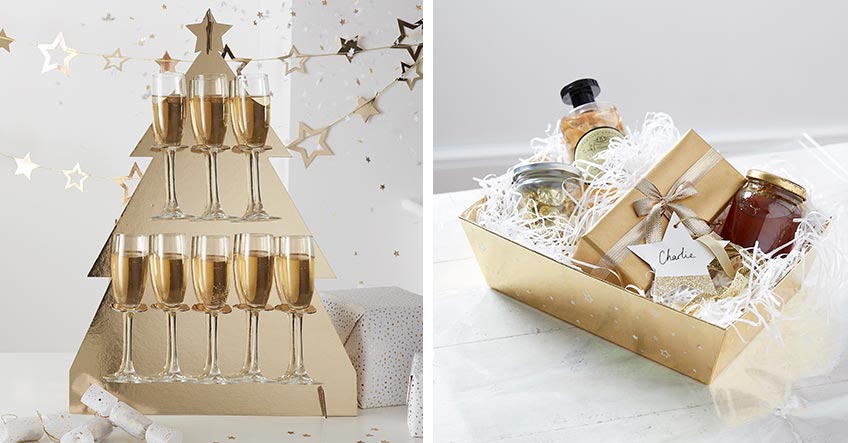 Champagner in goldenem Halter und glänzende Geschenkverpackung für edle Weihnachten Champagner in goldenem Halter und glänzende Geschenkverpackung für edle Weihnachten